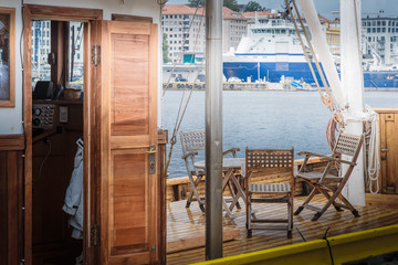 Table and chairs on Boat deck interior