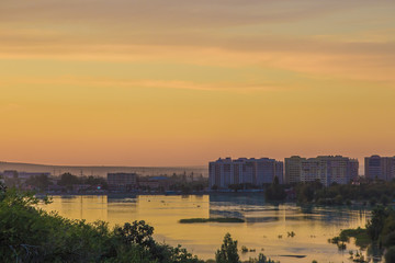 Fototapeta premium Sayran lake - evening city view, Almaty, Kazakhstan
