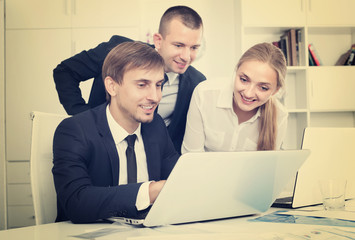 three business colleagues in office.