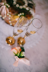 Obraz na płótnie Canvas Wedding glasses with polymer clay crown, beautiful decorated wedding glasses, yellow crown on wedding glasses, handmade wedding glasses