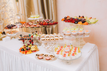 Delicious wedding reception candy bar dessert table