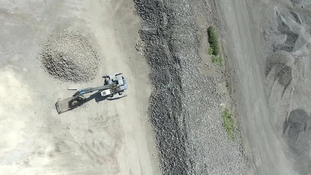 Degraded landscape in south of Poland. Destroyed land. Excavators digger works. View from above.