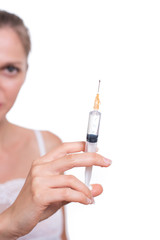 Syringe. Woman holding medical injection in hand, palm or finger