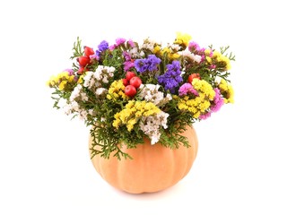 Flowers. Autumn flowers. Pumpkin vase and autumn flowers for holiday.  