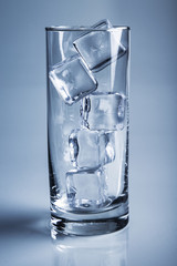 photo of empty glass with ice cubes on studio shot