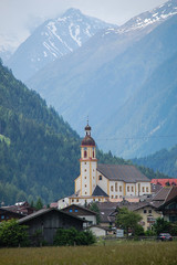 Church in the village among mountains 