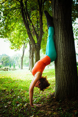 Fototapeta premium young woman practice balance outdoor