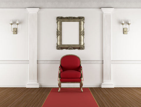 White classic interior with red armchair