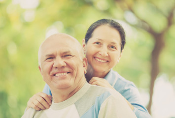 Fototapeta premium Happy mature couple together in autumn park