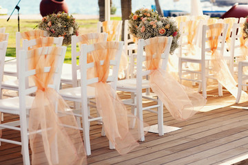 A lot of wedding chairs and luxurious tent