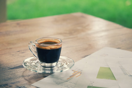 Image of business table with a cup of coffee,vintage tone.