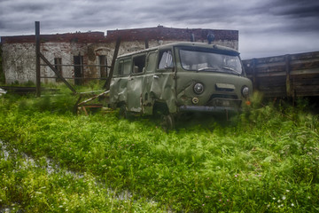 Apocalyptic scenery with old rusty Soviet car