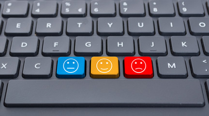 Close-up keyboard with three smiley keys