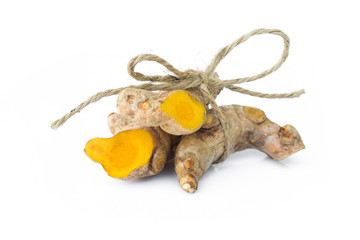 Closeup turmeric roots slices on white background