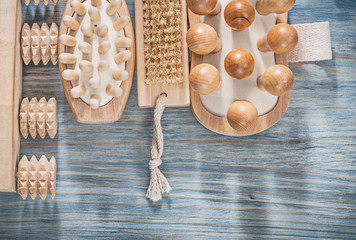 Wooden masseurs bath brush on wood board healthcare concept