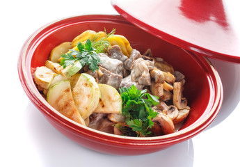 vegetable stew with meat,mushroom and herbs on a white background