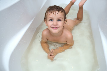 happy funny baby laughing and bathed in the bath

