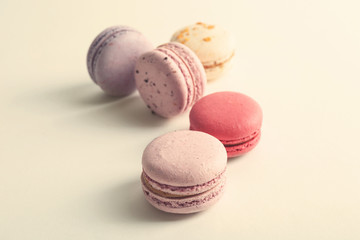 Colorful tasty macaroons on white background