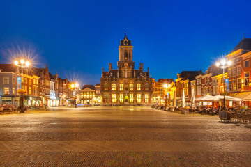 City Hall and typical Dutch houses on the Markt square in the center of the old city at night, Delft, Holland, Netherlands