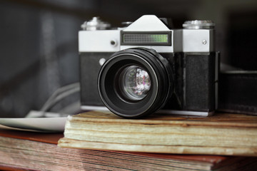 Vintage camera on photo albums