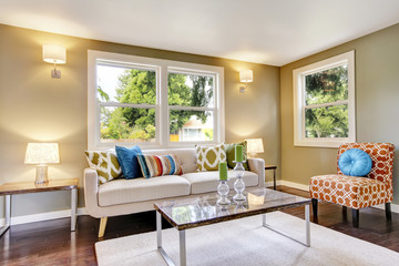 Modern furnished living room interior with hardwood floor