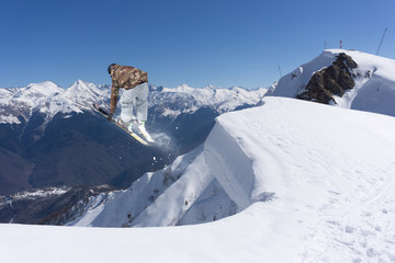 Fototapeta na wymiar Flying skier on mountains. Extreme winter sport.