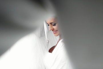 Pretty brunette smiling bride on the wedding day