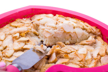 Charlotte from apples and the girl's hand, with a shovel