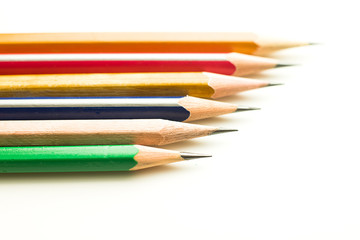Pencils of different colors are on white.