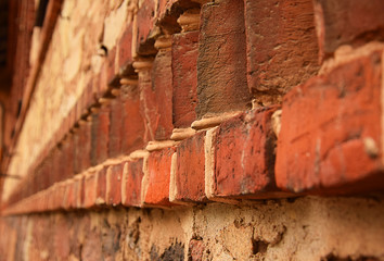 red brick wall with cement