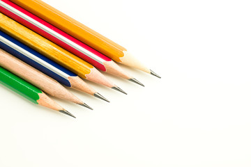 Pencils of different colors are on white.
