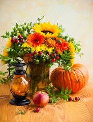 Fototapeta premium Autumn flowers and pumpkin