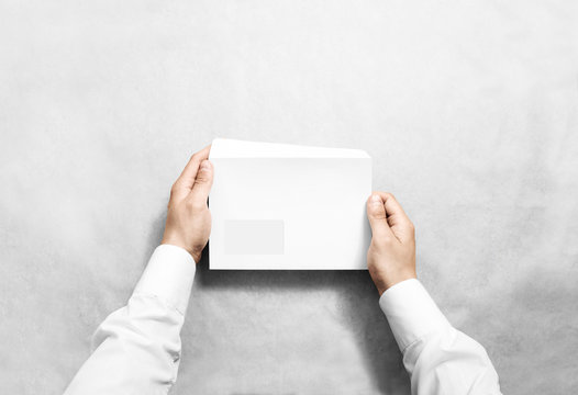 White blank envelope mockup hold in hands. Empty letter with transparent window design mock up. Message template presentation. Person open clear mail.