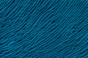 Blue background from soft textile material. Fabric with natural texture.
