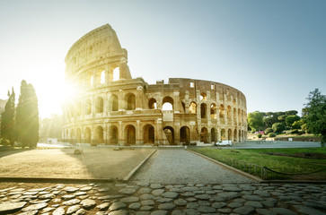 Fototapeta premium Colosseum in Rome and morning sun, Italy
