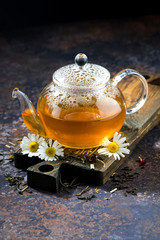 chamomile tea in a glass teapot, vertical © cook_inspire