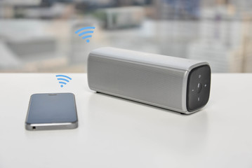 Bluetooth Speaker connected with mobile phone - obrazy, fototapety, plakaty