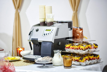 coffee maker and desserts with biscuits, decorated Banquet table.