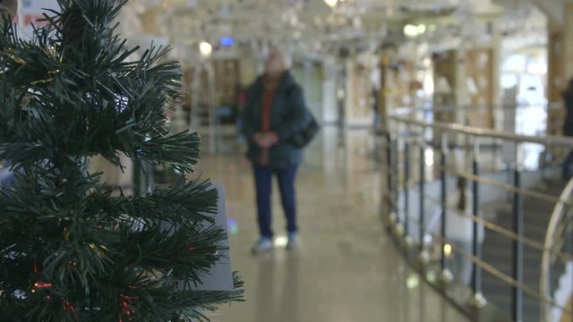 Customers in the lighting department decorated with Christmas trees