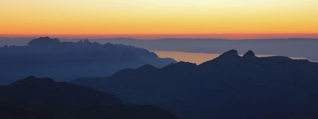 Mountains and stripe of Lake Geneva at sunset