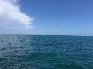 storm clouds over the ocean and an island
