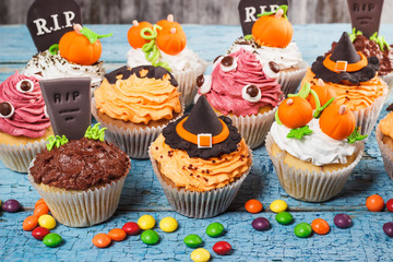 Halloween cupcakes with colored mastic decorations