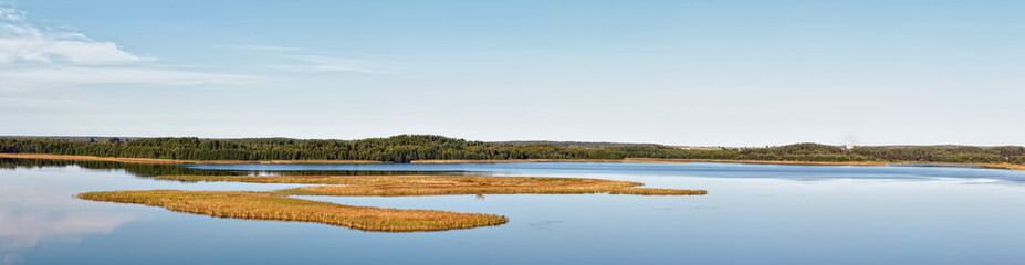 Panoramic view of the lake in summer day.