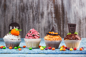Halloween cupcakes with colored mastic decorations