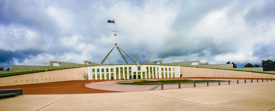 Panoramic view of Australian Parliament House with storm clouds above. Canberra, Australian Capital Territory, Australia.