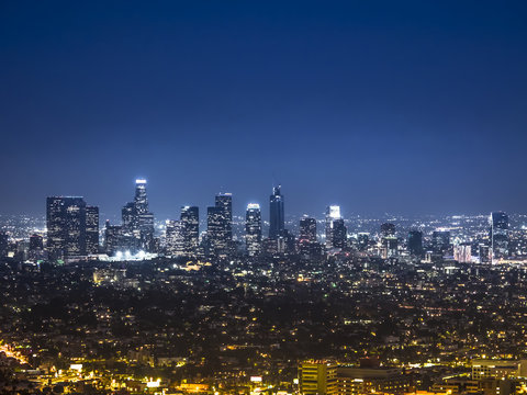 View of the downtown Los Angeles skyline at night, from Griffith Observatory, in Griffith Park, Los Angeles, California.