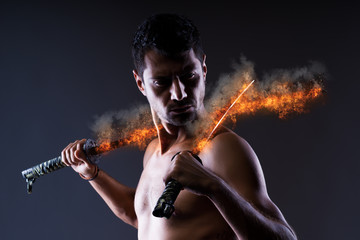 shirtless young man posing with katana © Netfalls