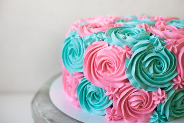  wedding cake decorated with cream roses close up