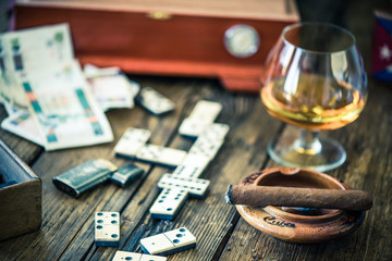 traditional cuban domino game, cigars and rum