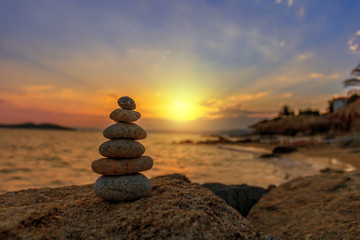 stone balance in sunrise